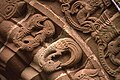five linked serpents swallowing each other's tails, a dragon swallowing its own tail, and part of the linked outer border of lion heads above it. The motif inside the ring is a curious "lion-bird", apparently a damaged winged lion's body repaired with a bird's head (12th century)